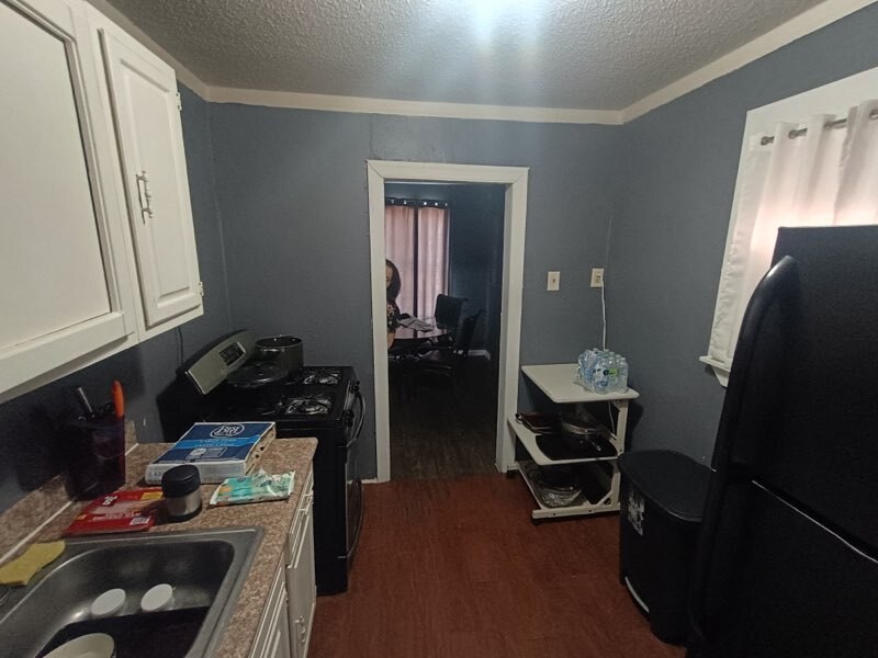 11914 Anchick Street Houston, TX 77076 - Photo 2 of 13 a room with storage and utility