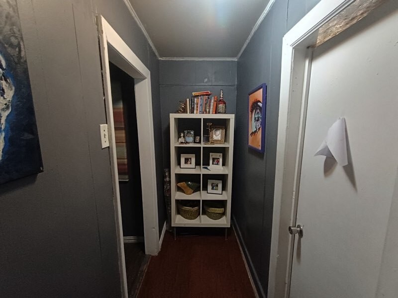 11914 Anchick Street Houston, TX 77076 - Photo 10 of 13 a view of a hallway with shelves