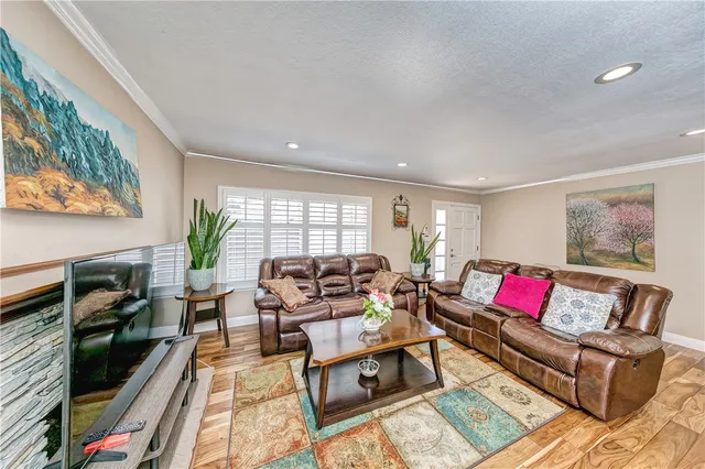 a living room with furniture fireplace and rug floor