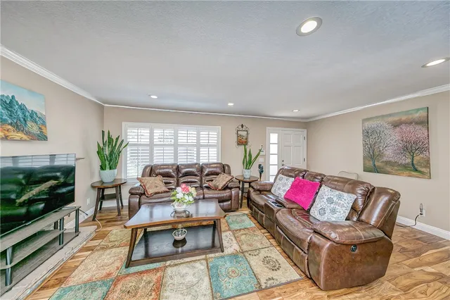 a living room with furniture fireplace and flat screen tv