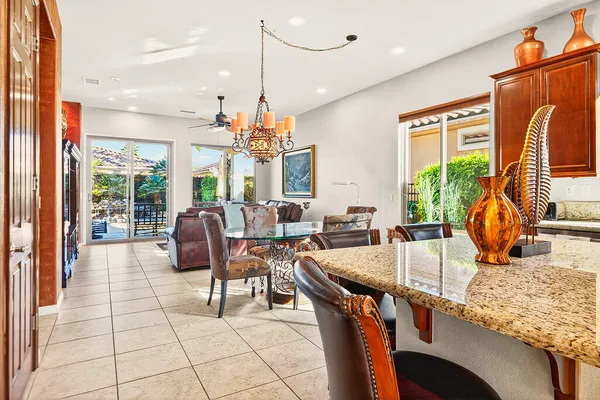 a very nice looking dining room with a large window