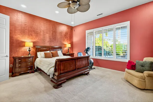 a bedroom with a bed and window