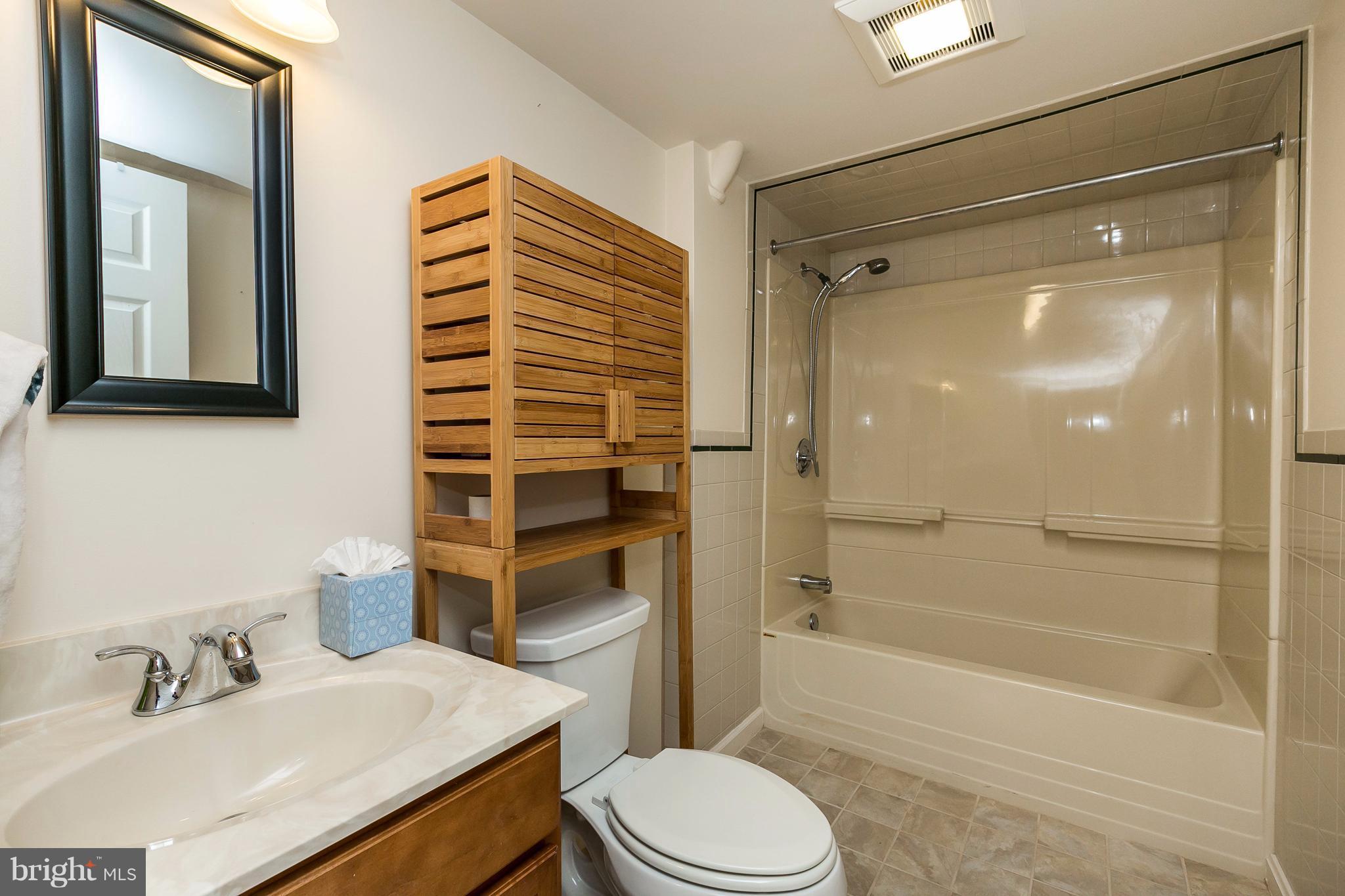 1613 Myamby Road Towson, MD 21286 - Photo 22 of 29 a bathroom with a sink toilet and shower