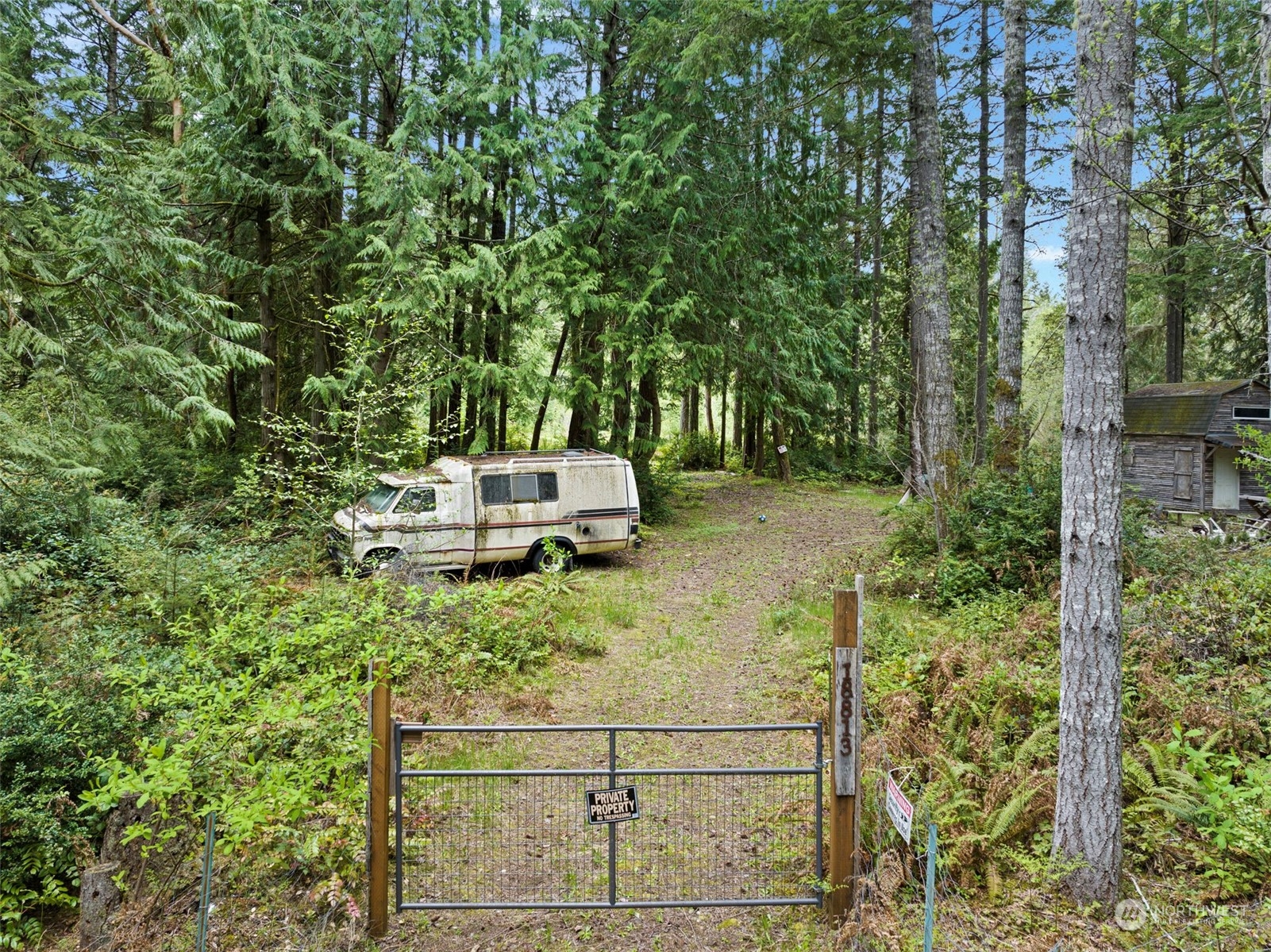18813 Rouse Road Southwest Longbranch, WA 98351 - Photo 2 of 11 a backyard of a house with outdoor seating