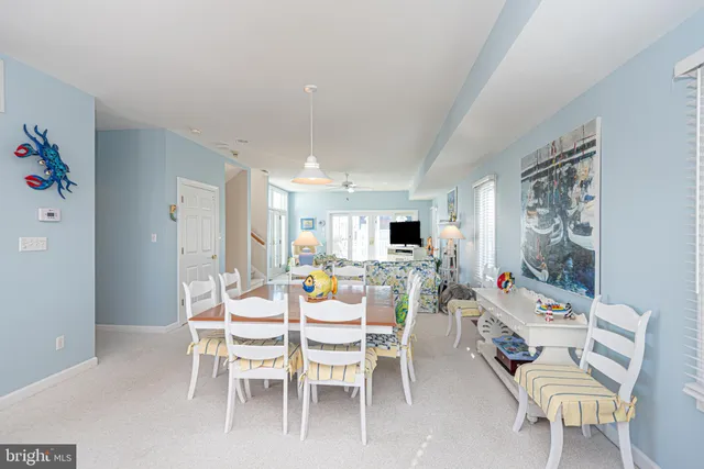 a view of a house with wooden deck