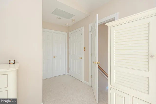 a white toilet sitting next to a shower curtain