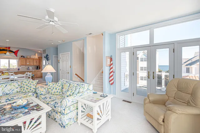 a kitchen with stainless steel appliances granite countertop a sink and a refrigerator