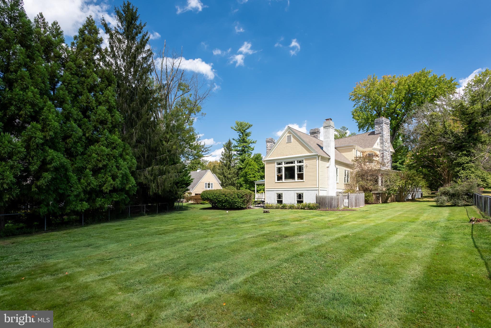 312 South Waterloo Road Devon, PA 19333 - Photo 61 of 70 a white house with a big yard and large trees