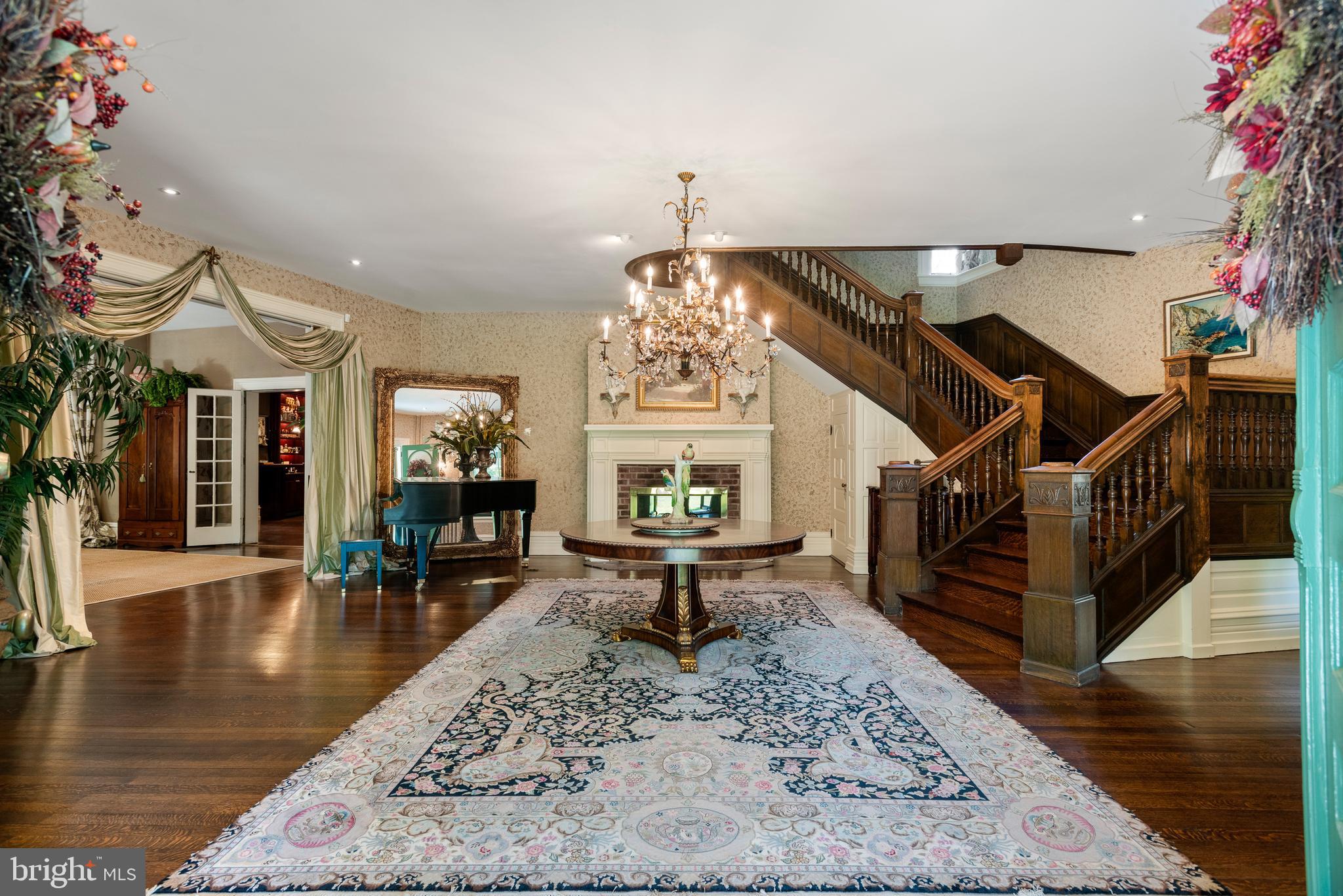 312 South Waterloo Road Devon, PA 19333 - Photo 7 of 70 a living room with furniture a chandelier and wooden floor