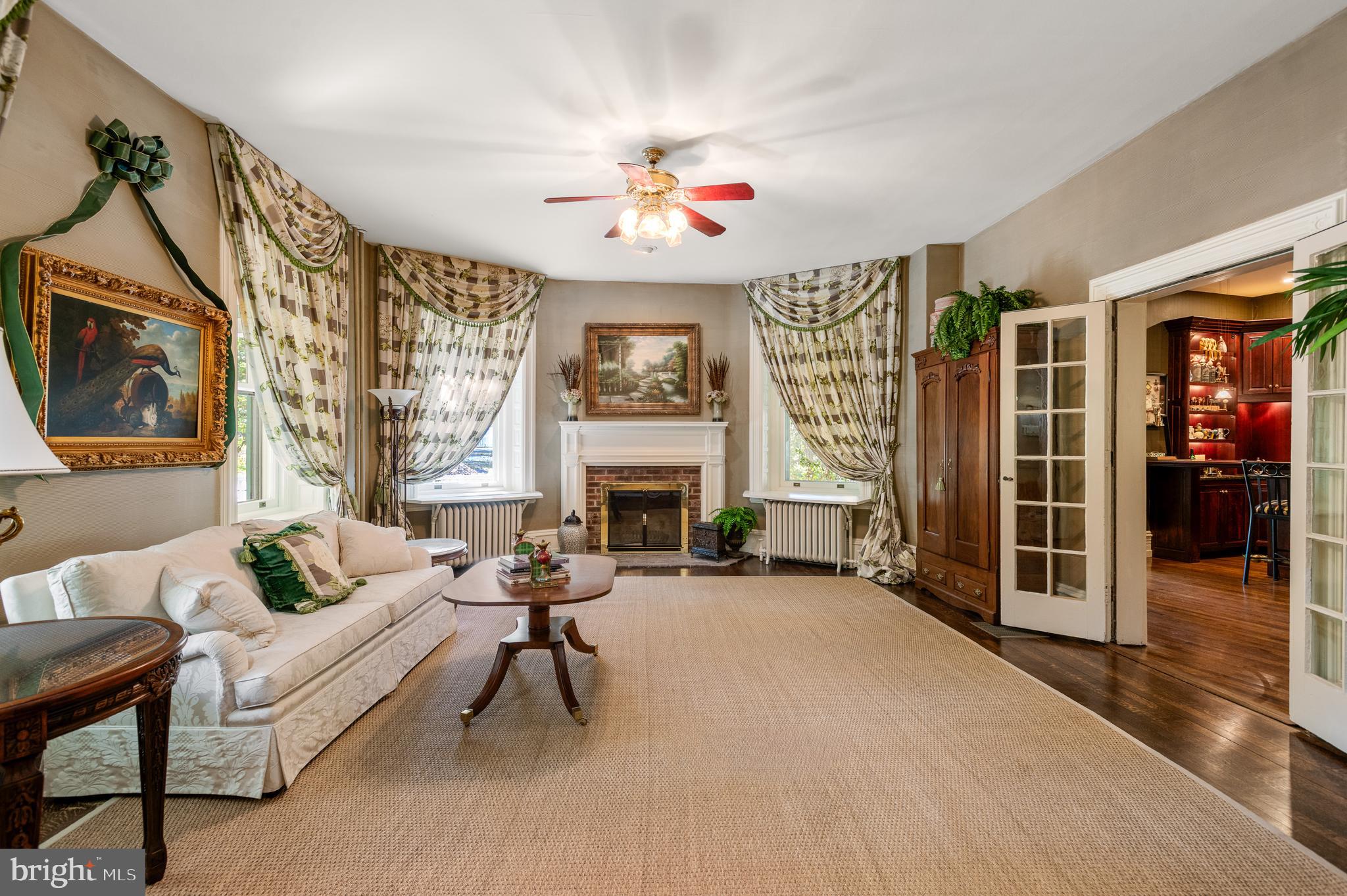 312 South Waterloo Road Devon, PA 19333 - Photo 10 of 70 Formal living room with fireplace
