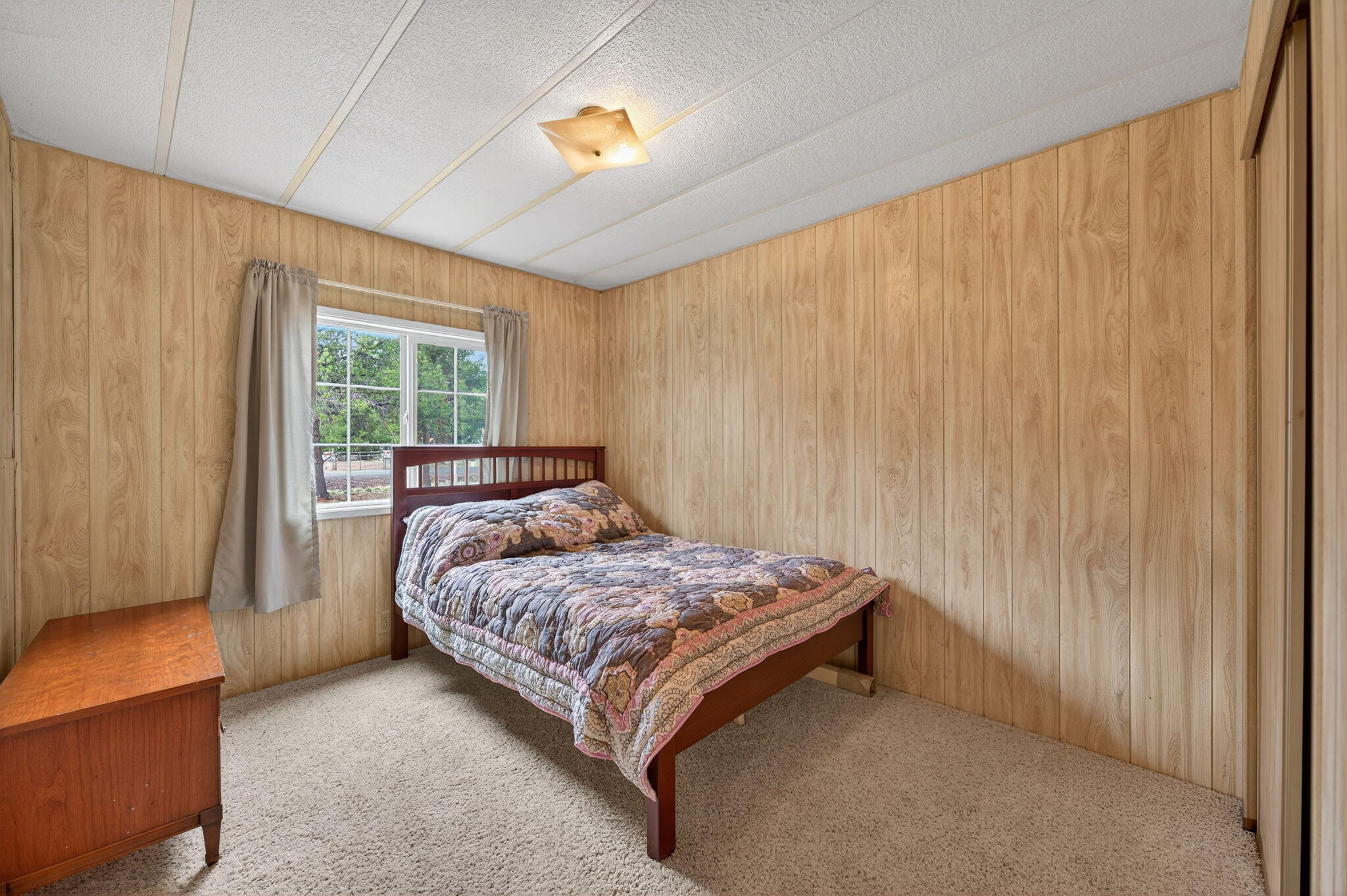 16274 Dyke Road La Pine, OR 97739 - Photo 7 of 20 a bedroom with a bed and a window