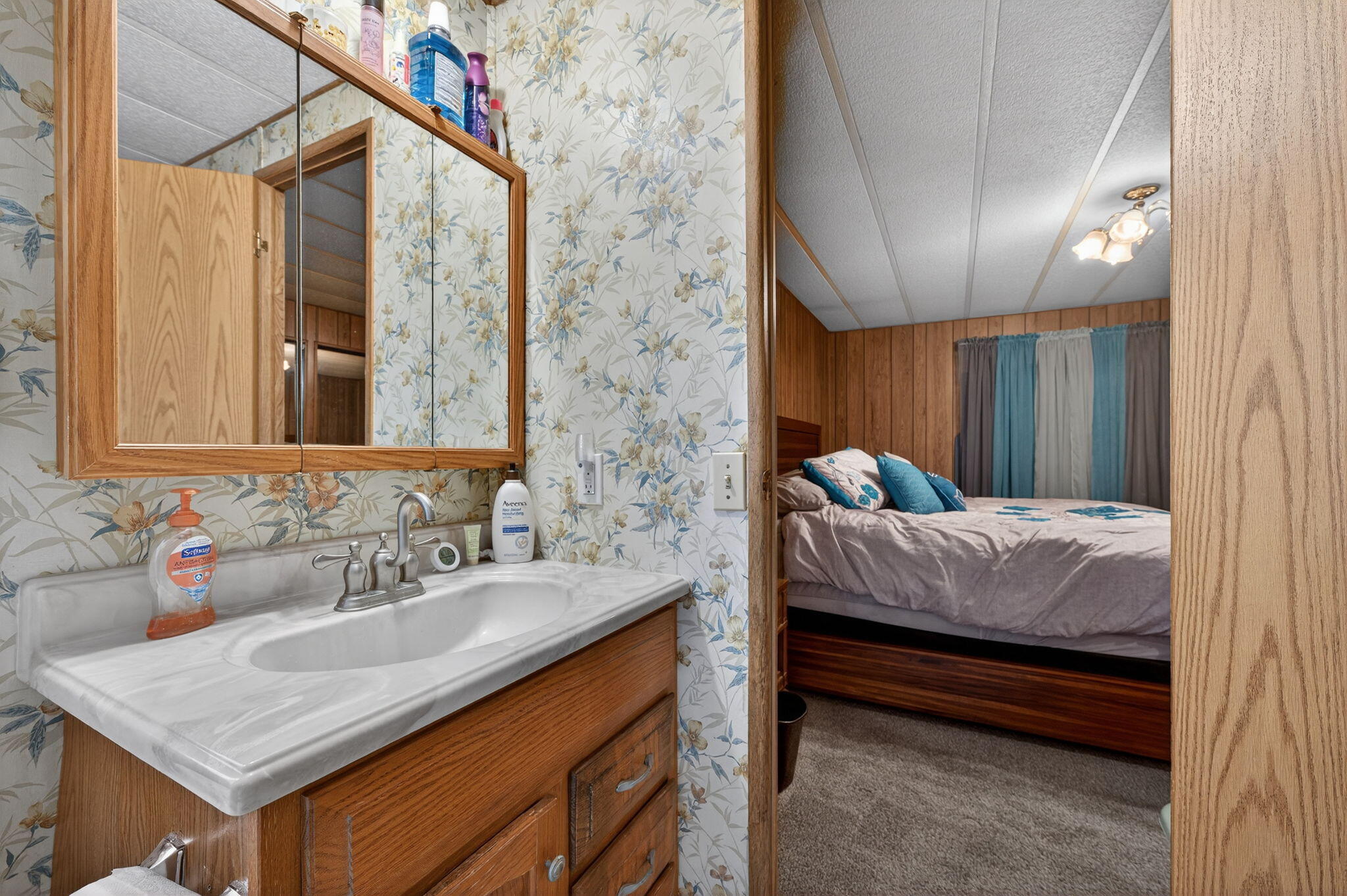 16274 Dyke Road La Pine, OR 97739 - Photo 9 of 20 a bedroom with a bed and a sink