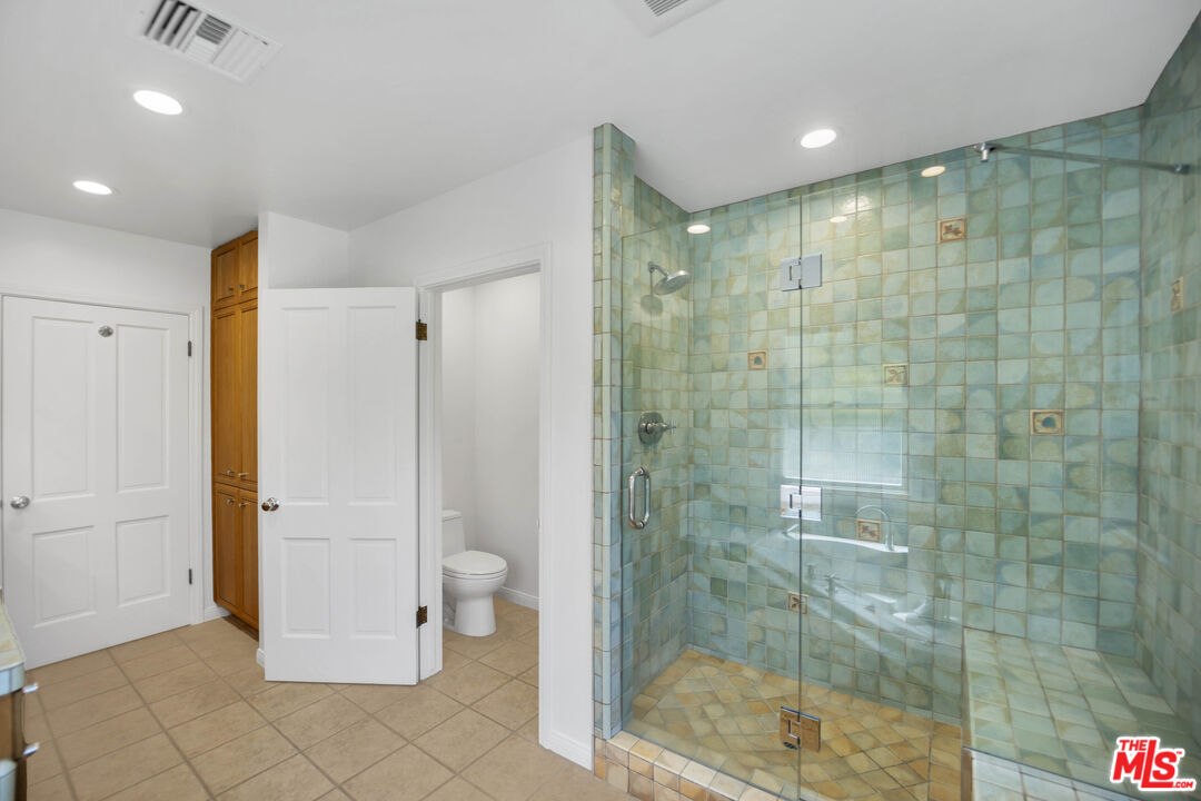 1231 Club View Drive Los Angeles, CA 90024 - Photo 13 of 19 a bathroom with a shower and a glass door