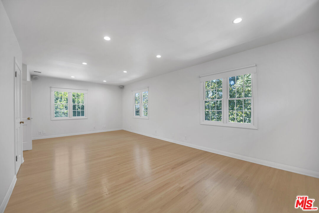 1231 Club View Drive Los Angeles, CA 90024 - Photo 10 of 19 an empty room with windows
