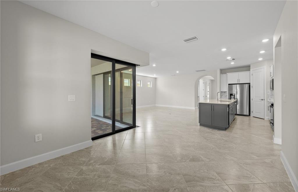17039 Oakstead Drive Alva, FL 33920 - Photo 16 of 49 a view of a big room with closet and windows