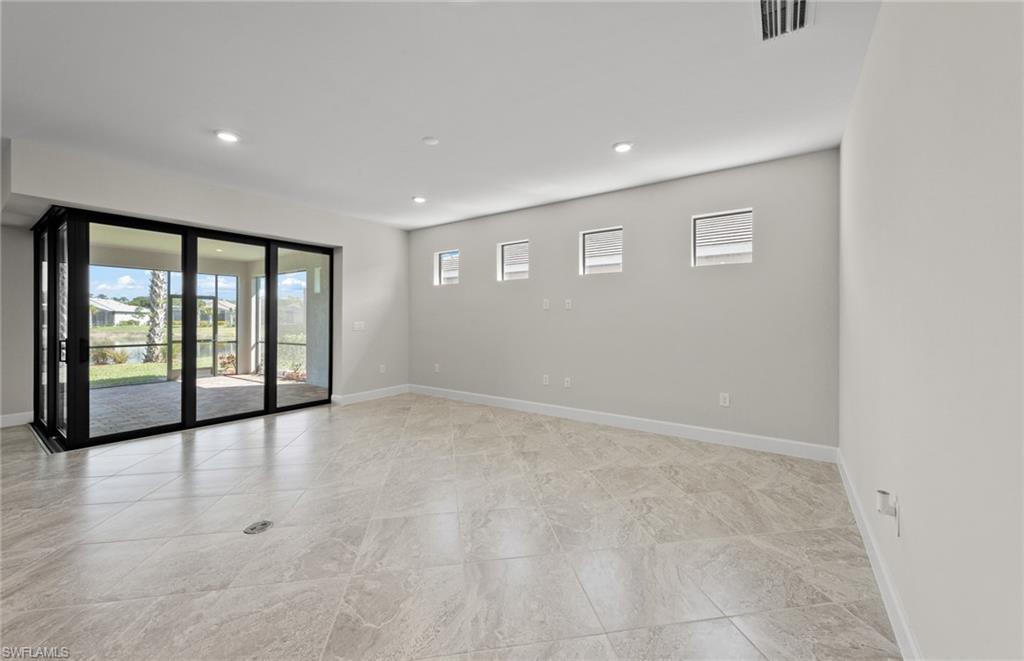 17039 Oakstead Drive Alva, FL 33920 - Photo 19 of 49 a view of an empty room with a window