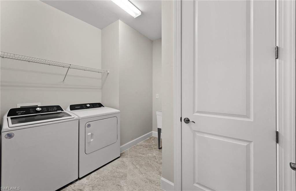 17039 Oakstead Drive Alva, FL 33920 - Photo 33 of 49 a utility room with dryer and washer