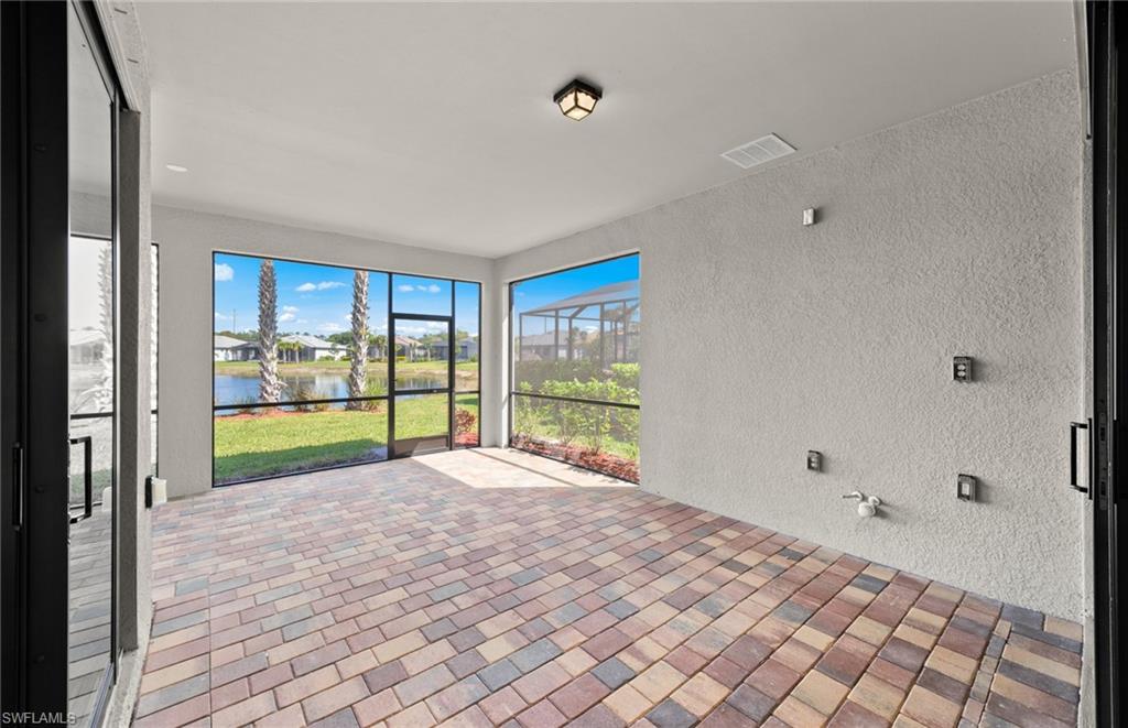 17039 Oakstead Drive Alva, FL 33920 - Photo 34 of 49 a view of an empty room with wooden floor and a window