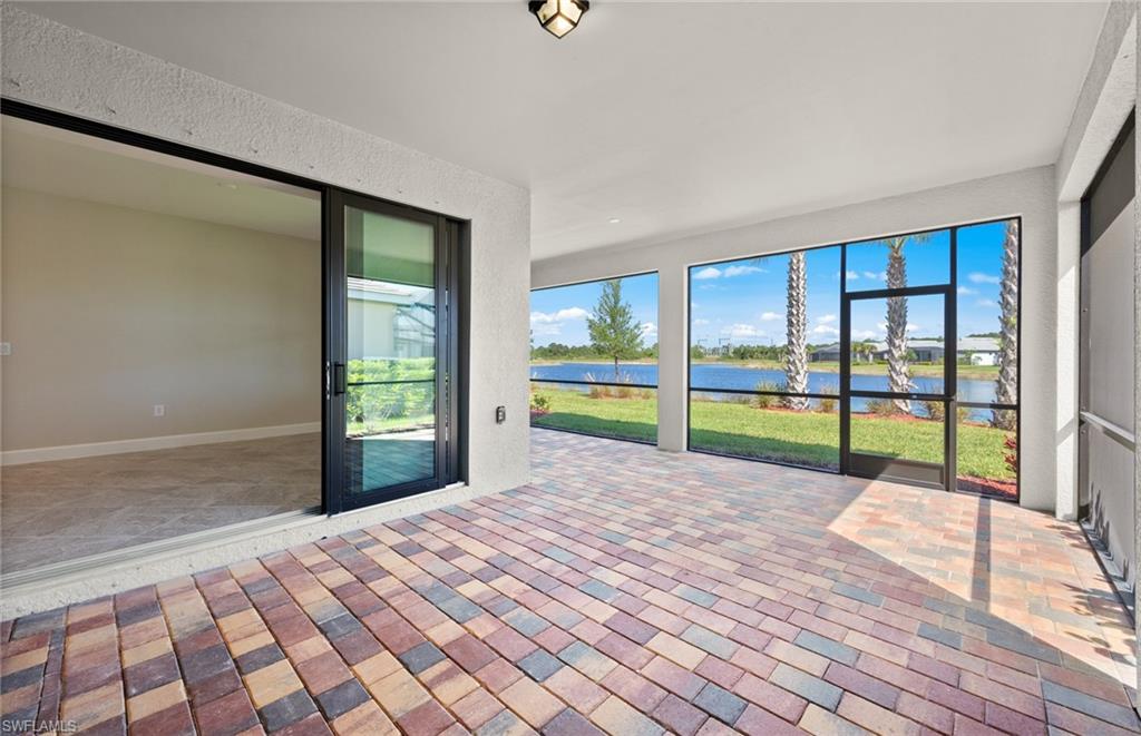 17039 Oakstead Drive Alva, FL 33920 - Photo 35 of 49 a view of an empty room with wooden floor and a window
