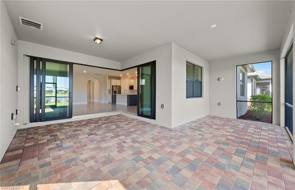 17039 Oakstead Drive Alva, FL 33920 - Photo 36 of 49 a view of an empty room with window and bathroom