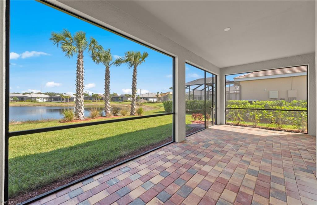 17039 Oakstead Drive Alva, FL 33920 - Photo 37 of 49 a view of a city from a big room with large windows