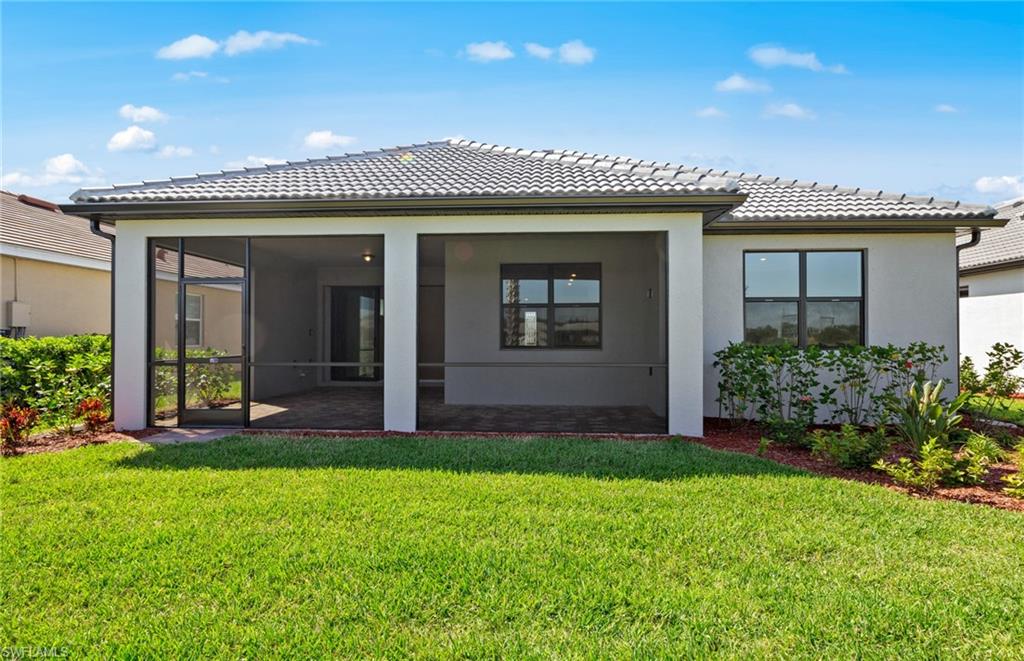 17039 Oakstead Drive Alva, FL 33920 - Photo 40 of 49 a view of a house with garden