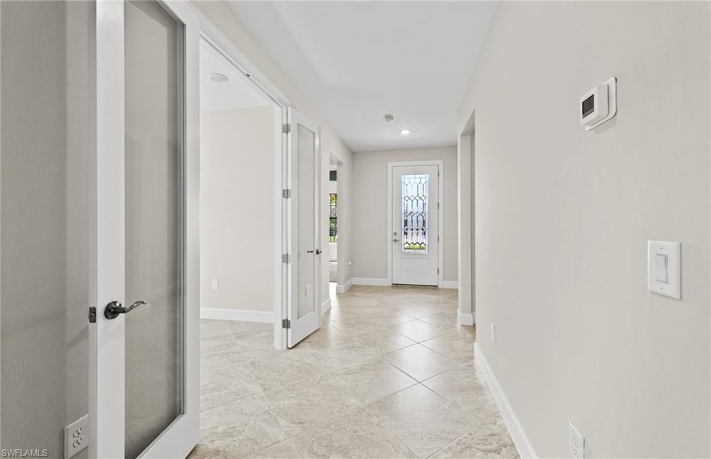 17039 Oakstead Drive Alva, FL 33920 - Photo 7 of 49 a view of a hallway with a bathroom
