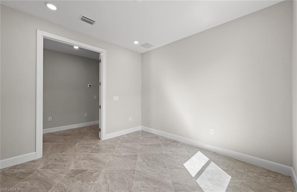 17039 Oakstead Drive Alva, FL 33920 - Photo 9 of 49 an empty room with an entryway