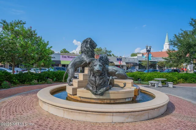 a view of a house with a fountain and a fountain