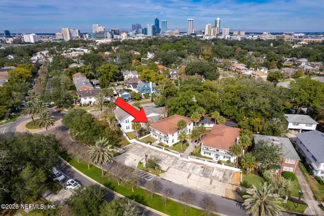an aerial view of residential houses with outdoor space