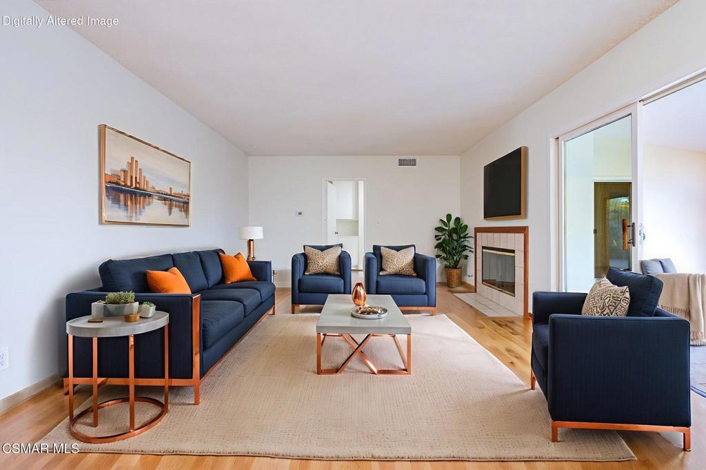 2085 Rayshire Street Thousand Oaks, CA 91362 - Photo 13 of 49 a living room with furniture a rug and a flat screen tv