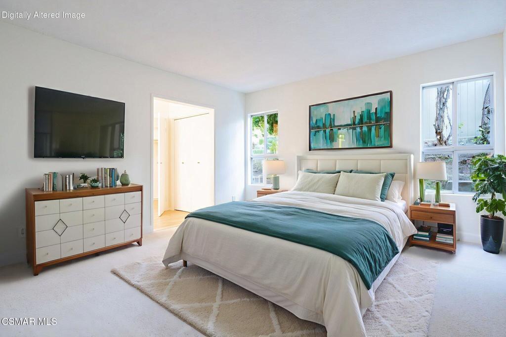 2085 Rayshire Street Thousand Oaks, CA 91362 - Photo 21 of 49 a bedroom with a large bed and a flat screen television