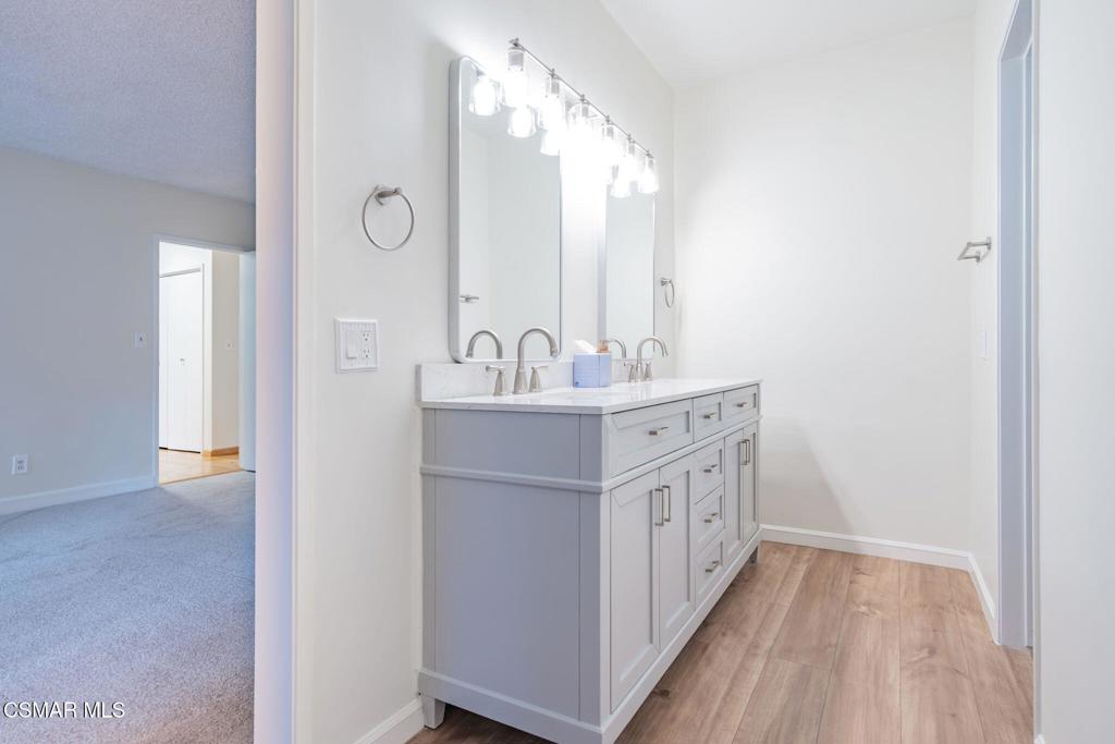 2085 Rayshire Street Thousand Oaks, CA 91362 - Photo 23 of 49 a bathroom with a double vanity sink mirror and