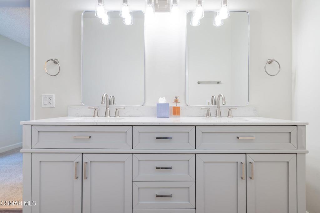 2085 Rayshire Street Thousand Oaks, CA 91362 - Photo 24 of 49 a bathroom with double vanity sink a mirror and shower