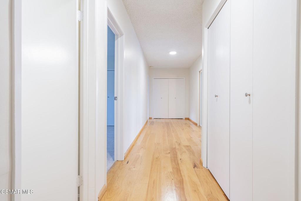 2085 Rayshire Street Thousand Oaks, CA 91362 - Photo 25 of 49 a view of a hallway with wooden floor