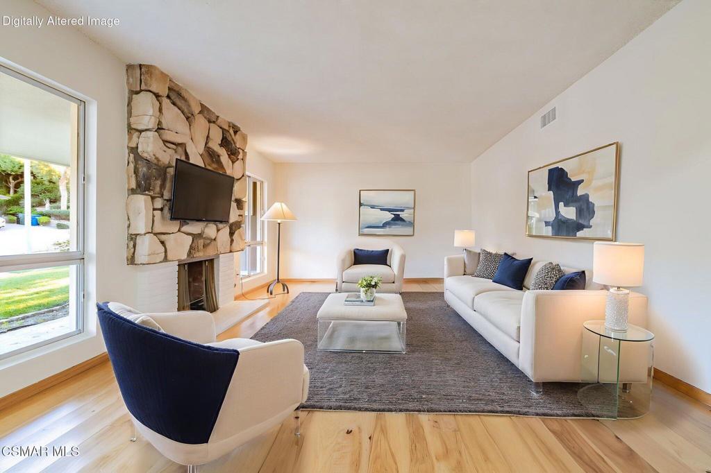 2085 Rayshire Street Thousand Oaks, CA 91362 - Photo 4 of 49 a living room with furniture and a flat screen tv