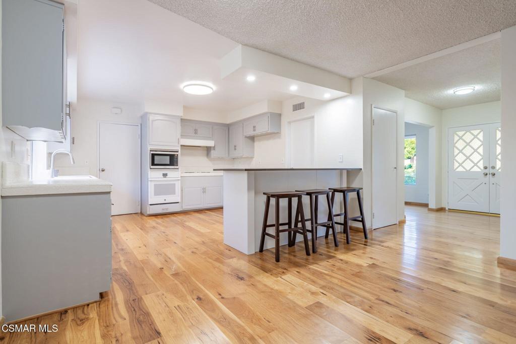 2085 Rayshire Street Thousand Oaks, CA 91362 - Photo 8 of 49 a large kitchen with a table and chairs