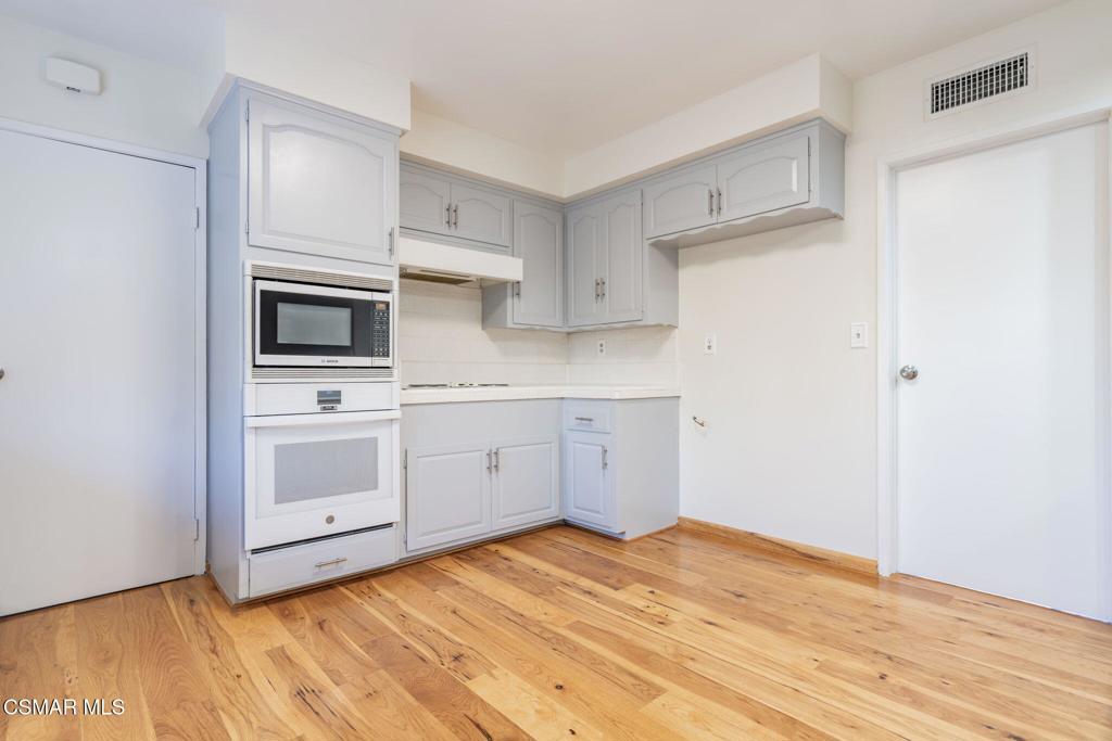 2085 Rayshire Street Thousand Oaks, CA 91362 - Photo 9 of 49 a kitchen with a sink cabinets and stainless steel appliances