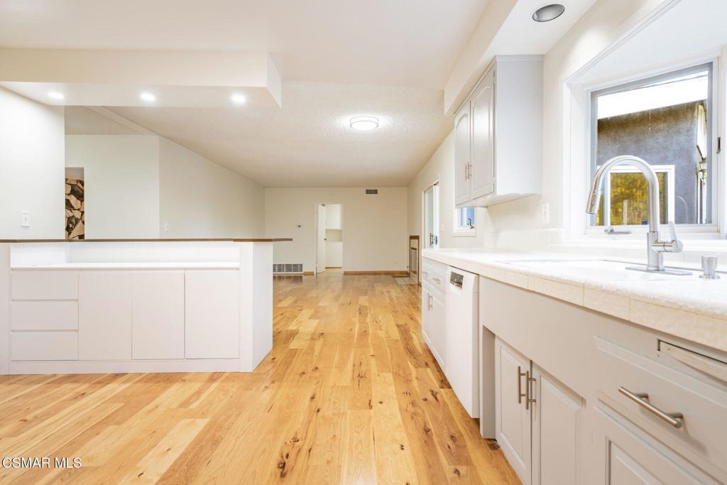 2085 Rayshire Street Thousand Oaks, CA 91362 - Photo 10 of 49 a bathroom with a sink a large mirror and vanity