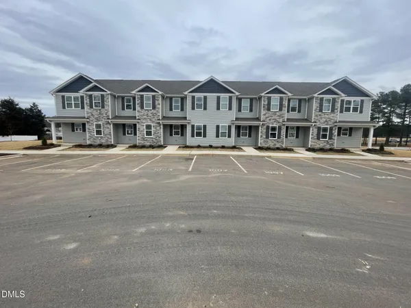 a front view of a building with a street