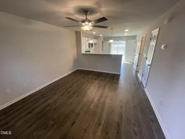 wooden floor in an empty room with a mirror