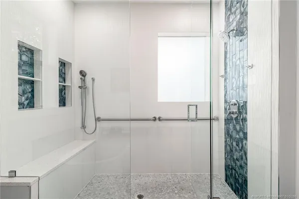 a white bath tub sitting in a bathroom