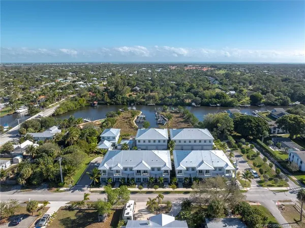 an aerial view of a house with a lake view