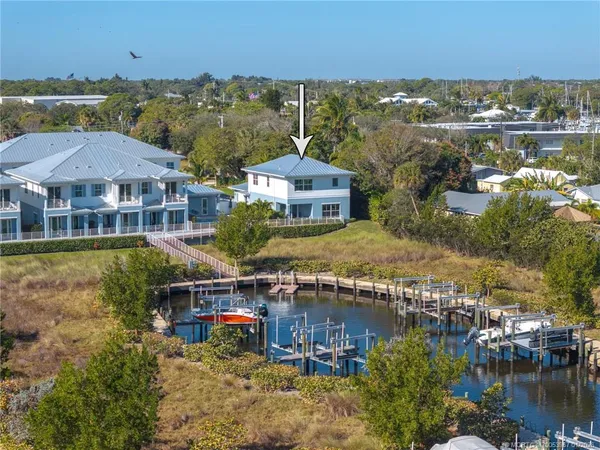 an aerial view of residential houses with outdoor space