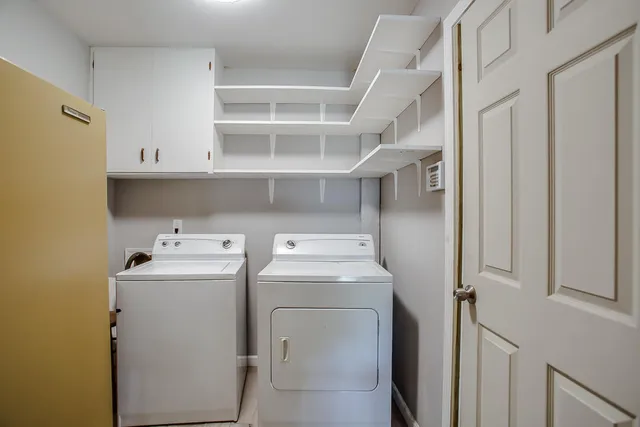 a backyard of a house with yard and barbeque oven