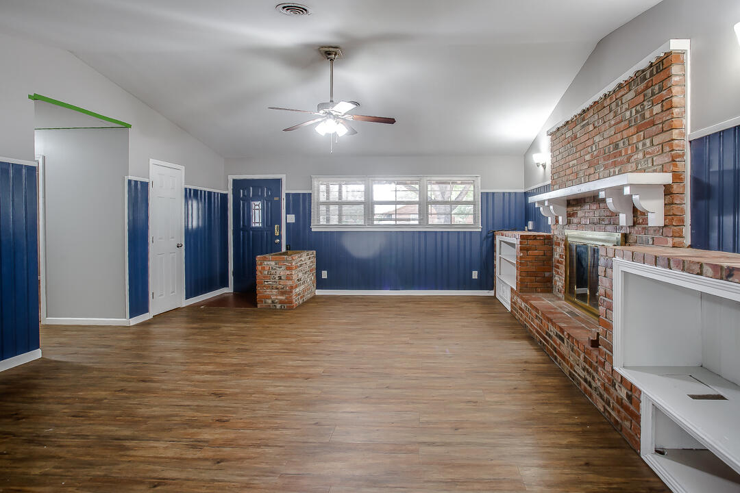 4402 28th Street Lubbock, TX 79410 - Photo 6 of 18 a view of a kitchen with a sink and microwave