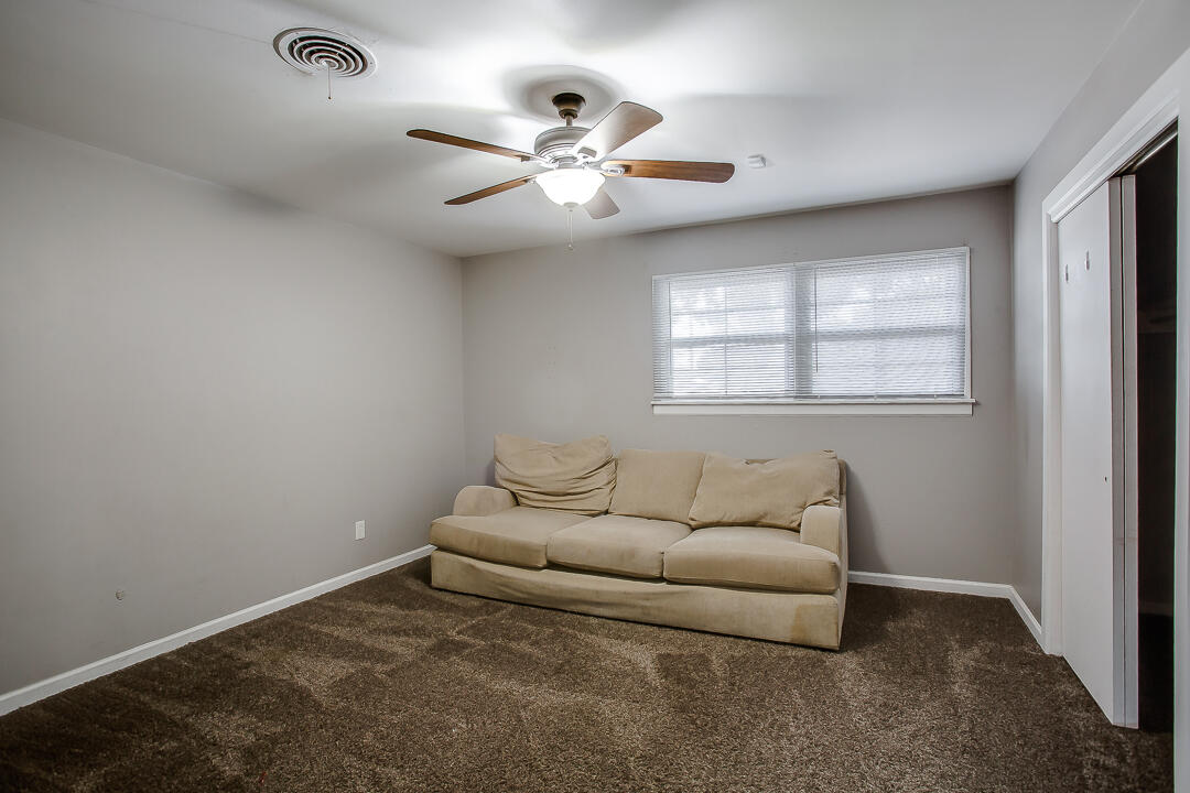 4402 28th Street Lubbock, TX 79410 - Photo 8 of 18 a living room with furniture and a window