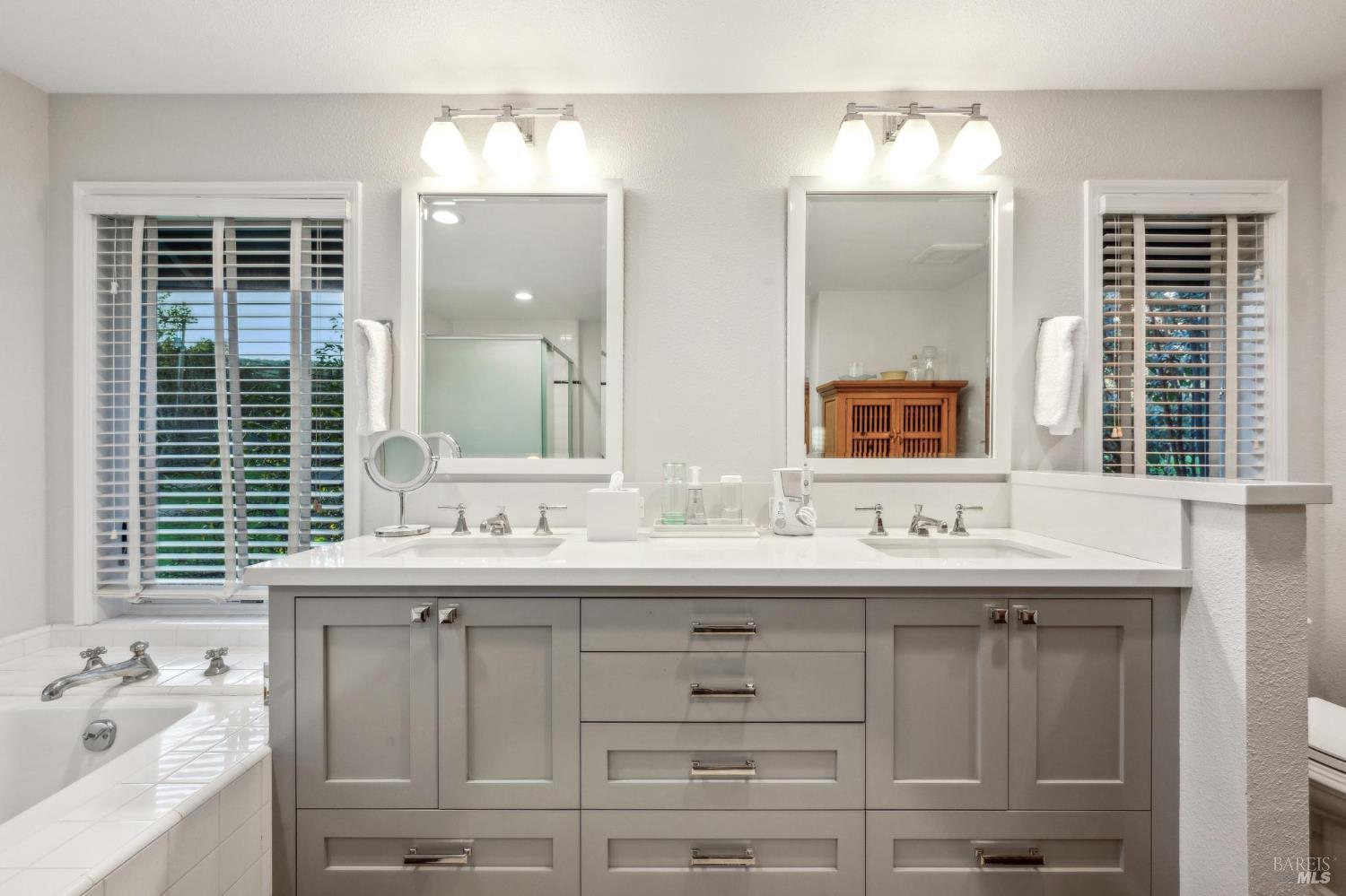 2220 Grove Street Sonoma, CA 95476 - Photo 14 of 25 a bathroom with a sink double vanity and a mirror
