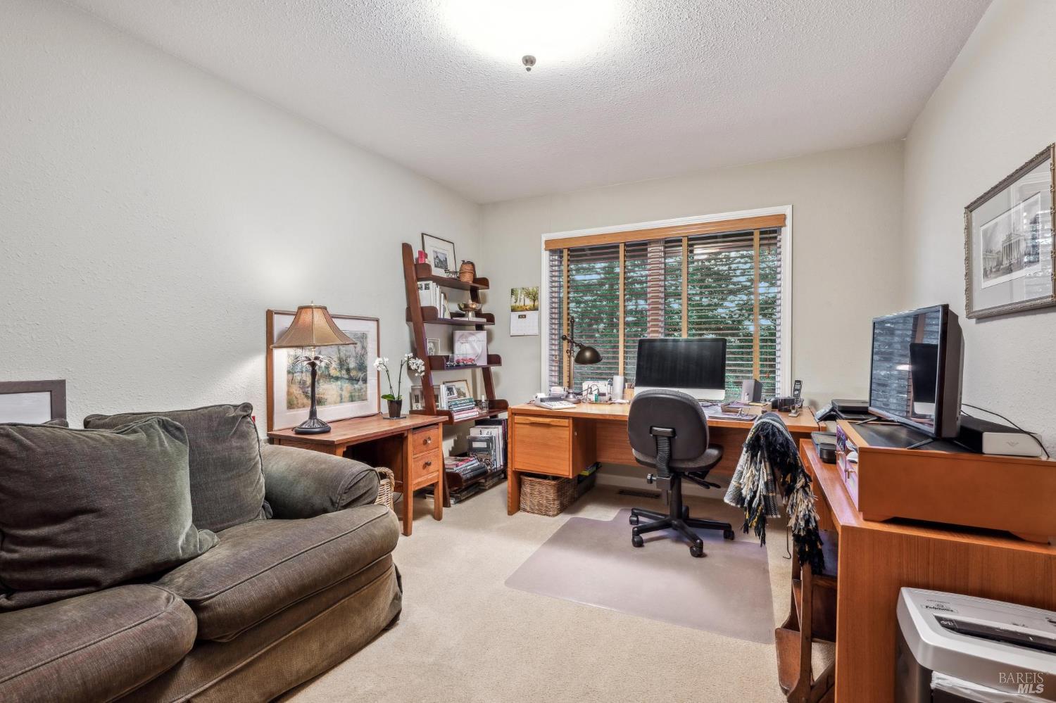 2220 Grove Street Sonoma, CA 95476 - Photo 15 of 25 a view of a livingroom with workspace and a window