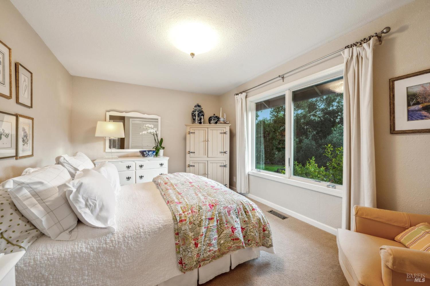 2220 Grove Street Sonoma, CA 95476 - Photo 16 of 25 a bedroom with a bed and a large window